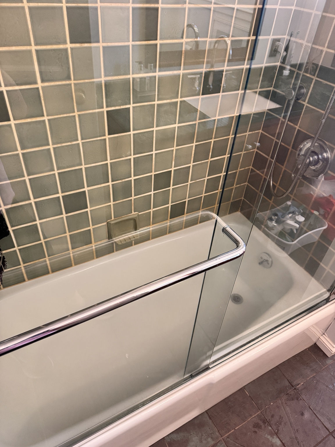 Clean bathtub and glass enclosure
